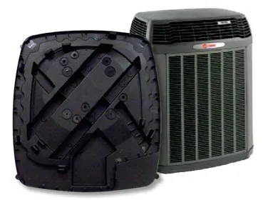 black composite base part next to finished hvac product